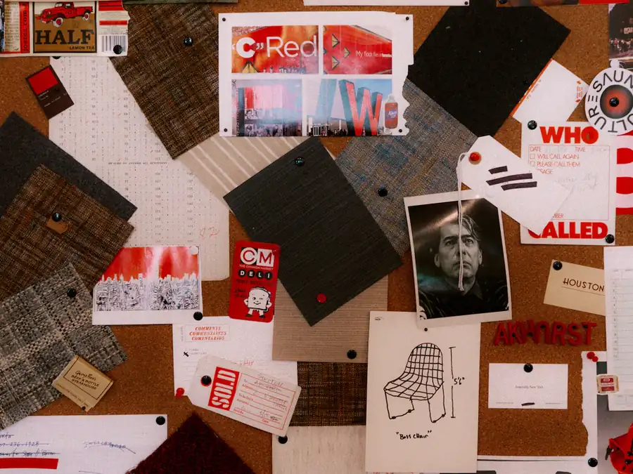 A moodboard of papers, fabric swatches and images